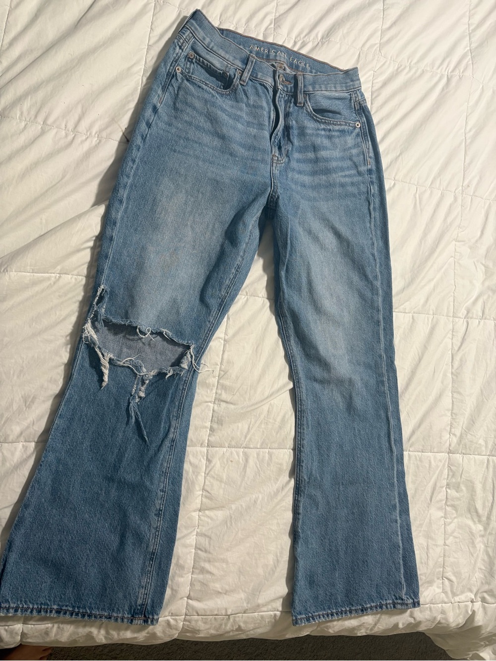 American Eagle Outfitters Light Wash Flare Jeans with Distressed Knee